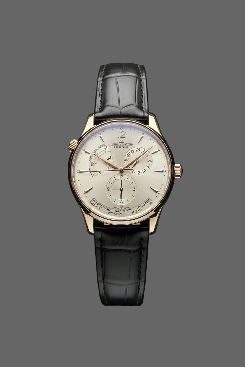 Gold-tone round watch with a light multi-section dial and black embossed strap.