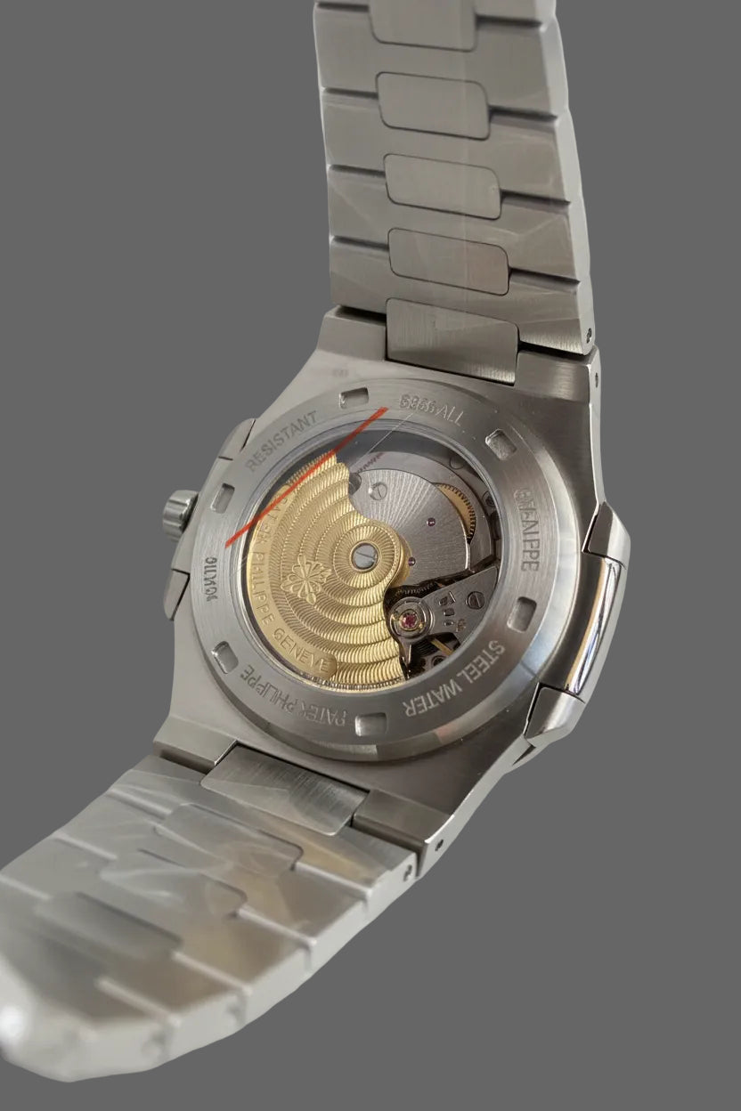 Rear view of a bracelet watch showing a transparent caseback.