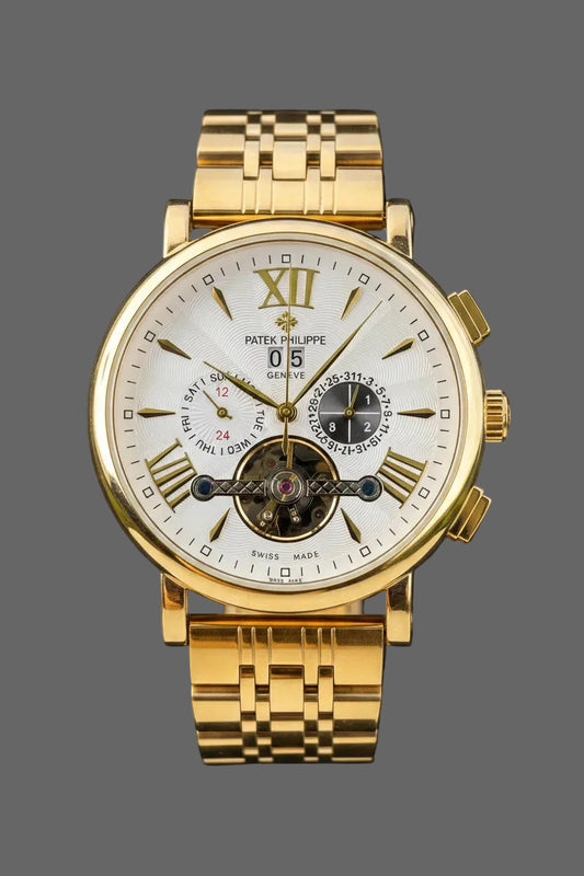 Gold-tone bracelet watch with a light dial, Roman-numeral accents and an open-heart detail.